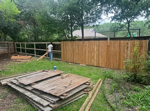 Residential fence under construction