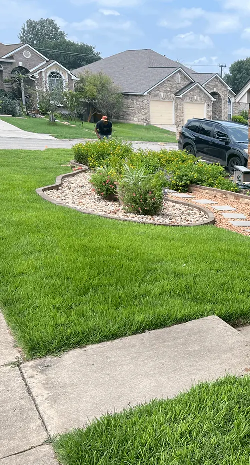 Stone walkway installation leading to a front entry