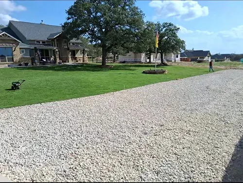 Rock and mulch landscaping installation in a residential yard